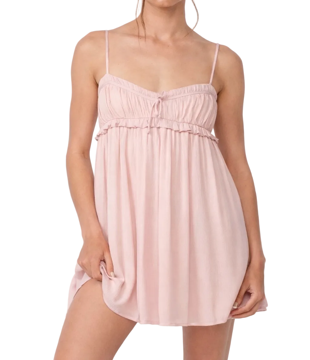 Riley dress in light pink with ruffled gathered bodice and spaghetti straps