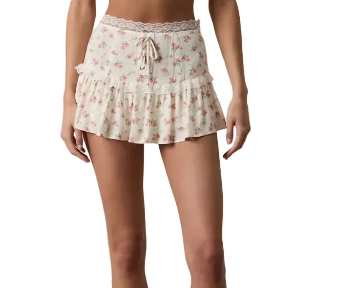 Cream floral mini skirt with tiered ruffle hem, elastic waist and drawstring tie