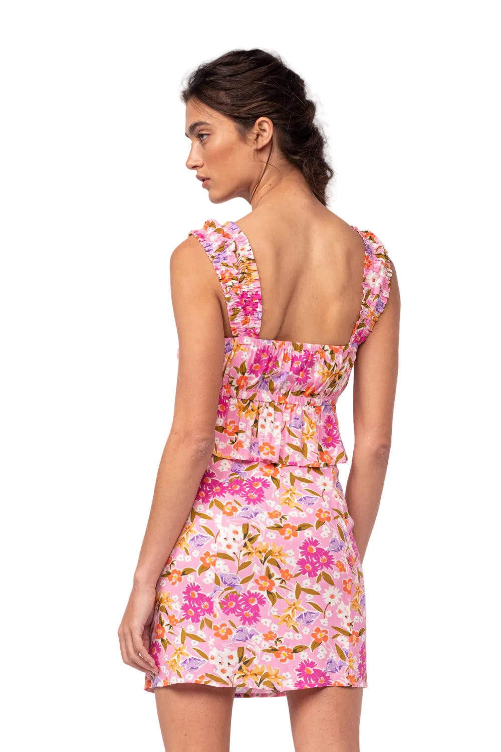 Floral two-piece set, back view: ruffled pink crop top with mini skirt