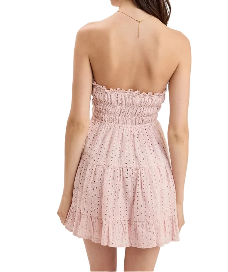 Back of Quinn dress, light pink strapless smocked bodice with tiered mini skirt