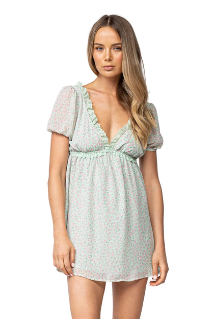 Light blue floral babydoll dress with ruffled V-neck and puff sleeves, short hem