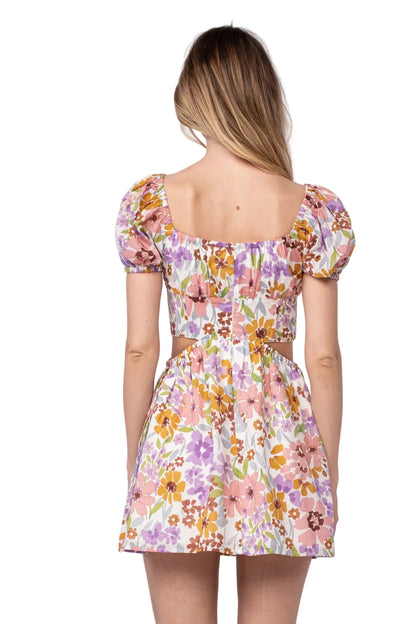 Floral print mini dress back view with square yoke and short puff sleeves, gathered waist
