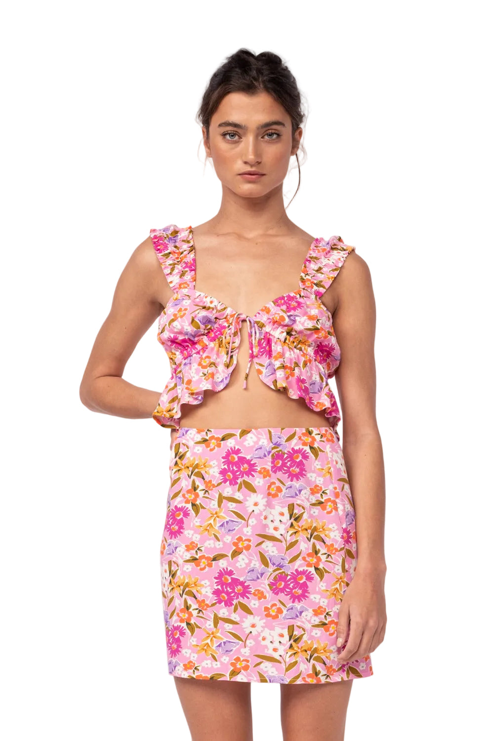 Floral two-piece set with ruffled pink crop top and matching mini skirt