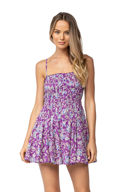 Purple floral babydoll dress with thin straps and gathered bodice, above-knee length