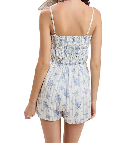 Mari romper with thin spaghetti straps, smocked bodice, blue floral print short legs