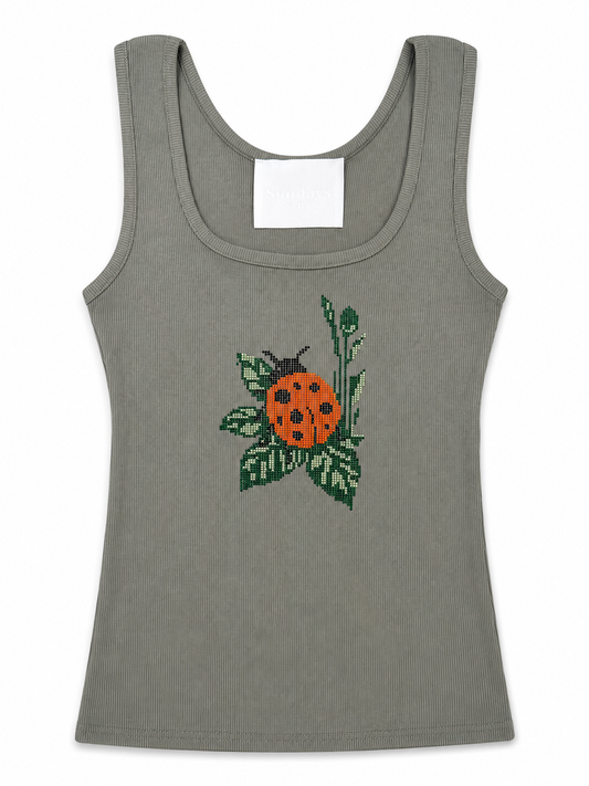 Olive green ribbed tank top with rhinestone ladybug and leaf applique on front