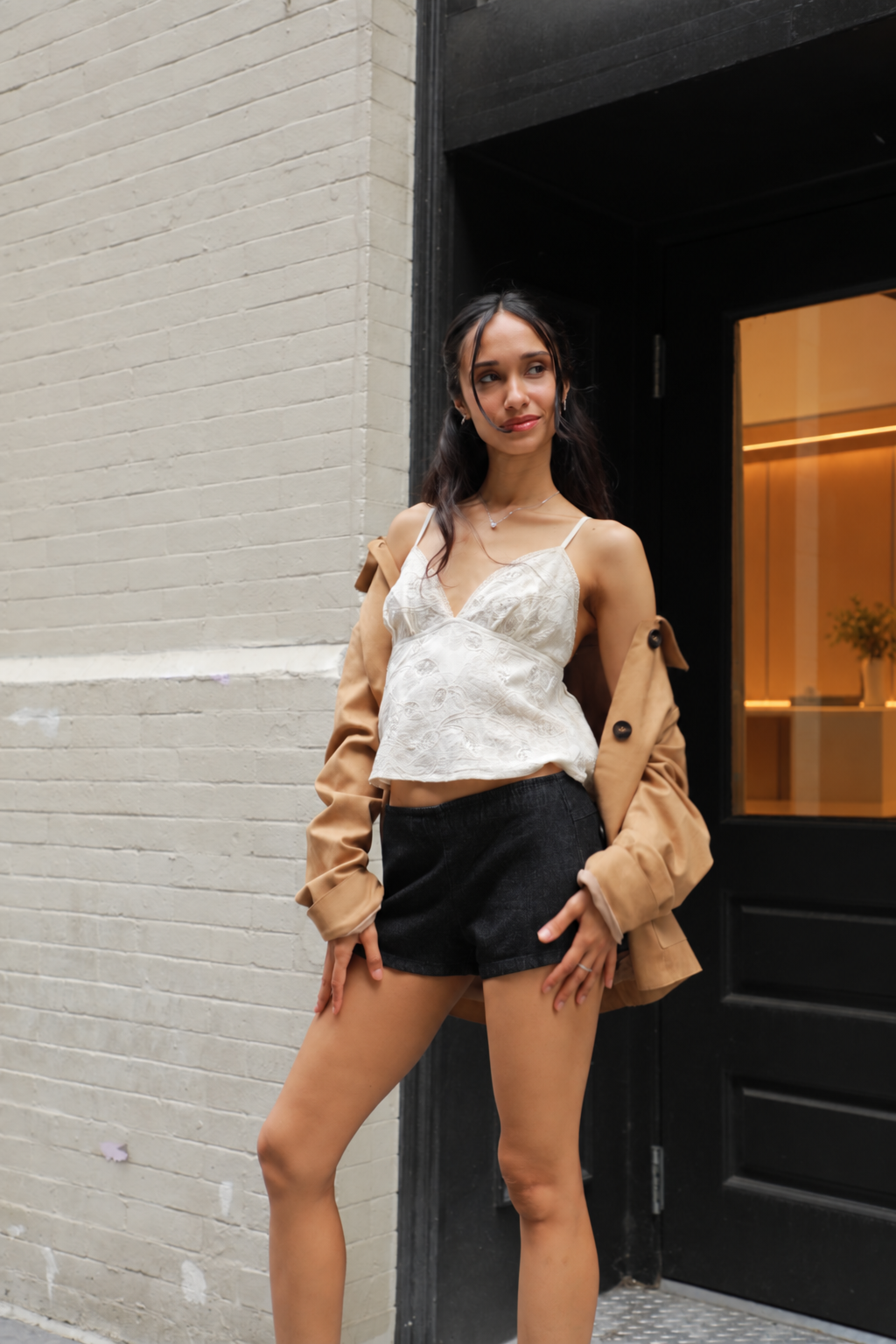 White camisole top with spaghetti straps and lace-trim neckline