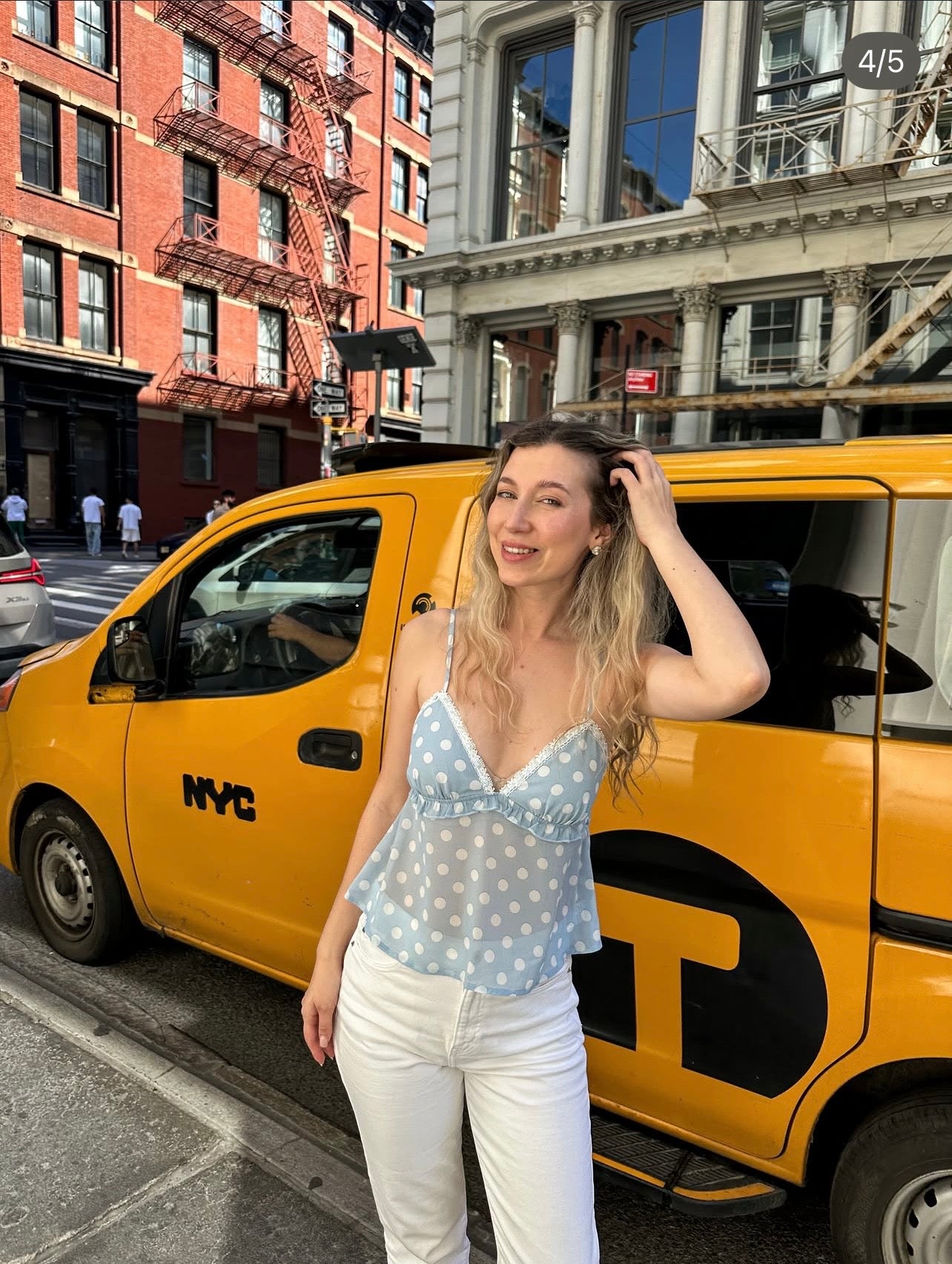 Light blue polka-dot V-neck camisole top with thin spaghetti straps