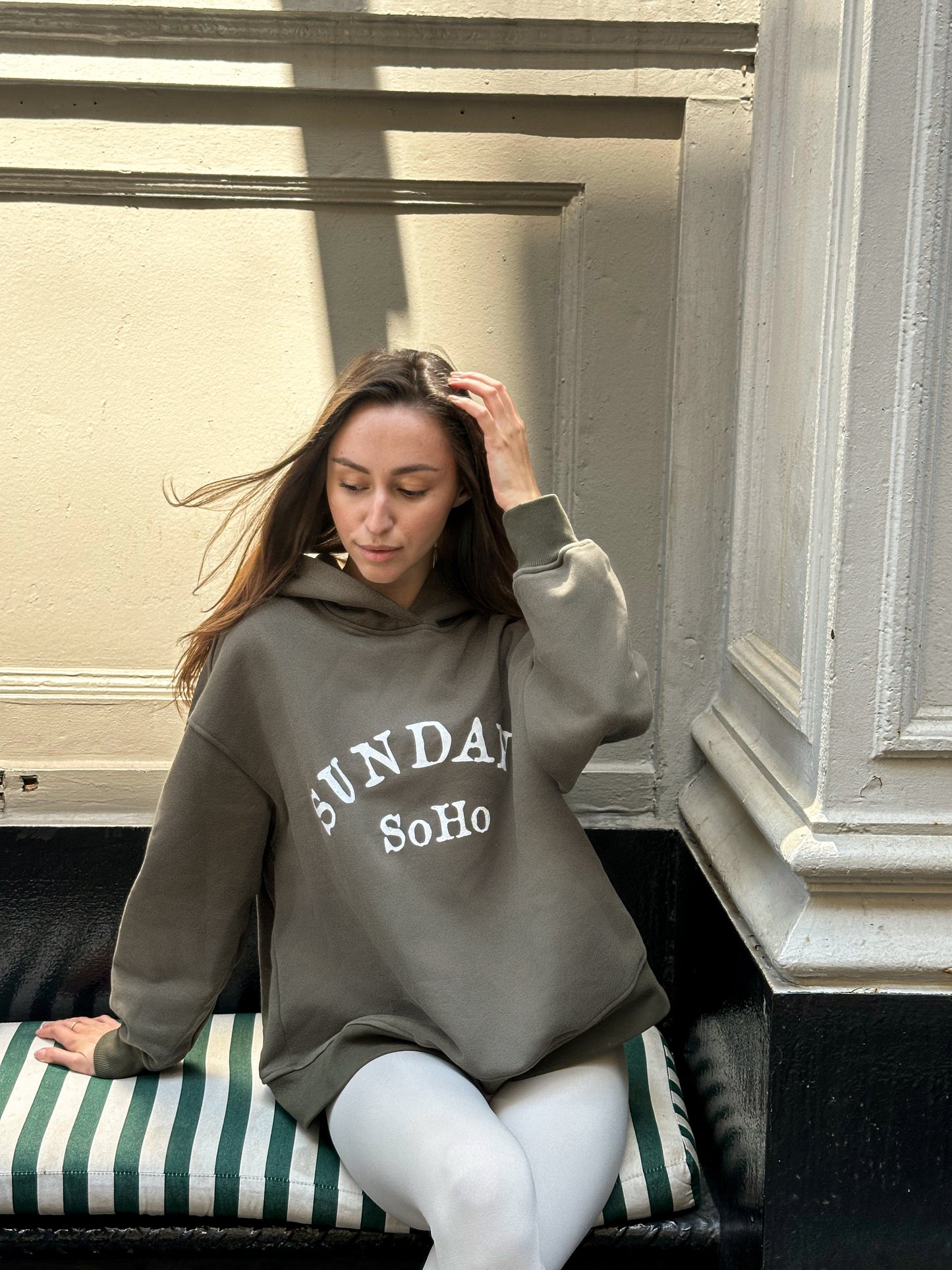 Gray pullover hoodie with hood and front pocket, 'SUNDAY SoHo' graphic print