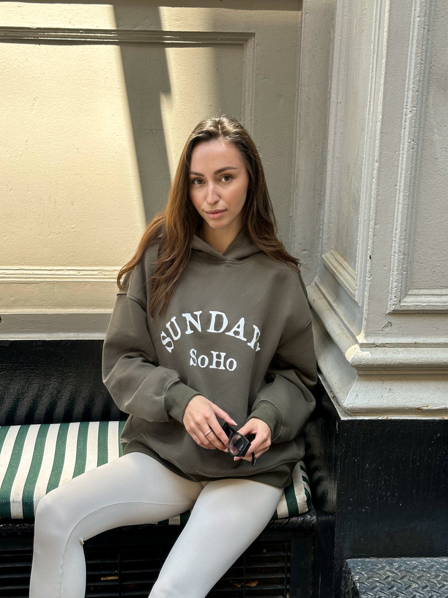 Gray hoodie with hood and front pocket, 'SUNDAY SoHo' graphic print, long sleeves
