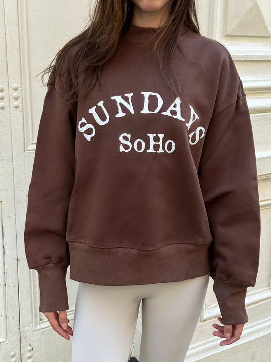 Dark brown crewneck sweatshirt with white 'SUNDAYS' chest graphic