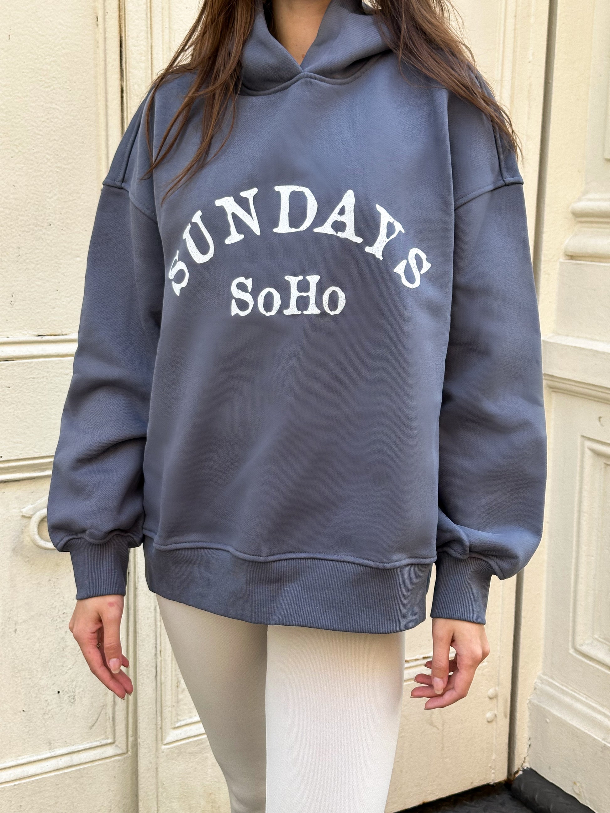 Slate blue Sunday Hoodie with white 'SUNDAY SoHo' front graphic