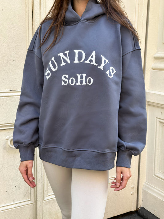 Slate blue Sunday Hoodie with white 'SUNDAY SoHo' front graphic
