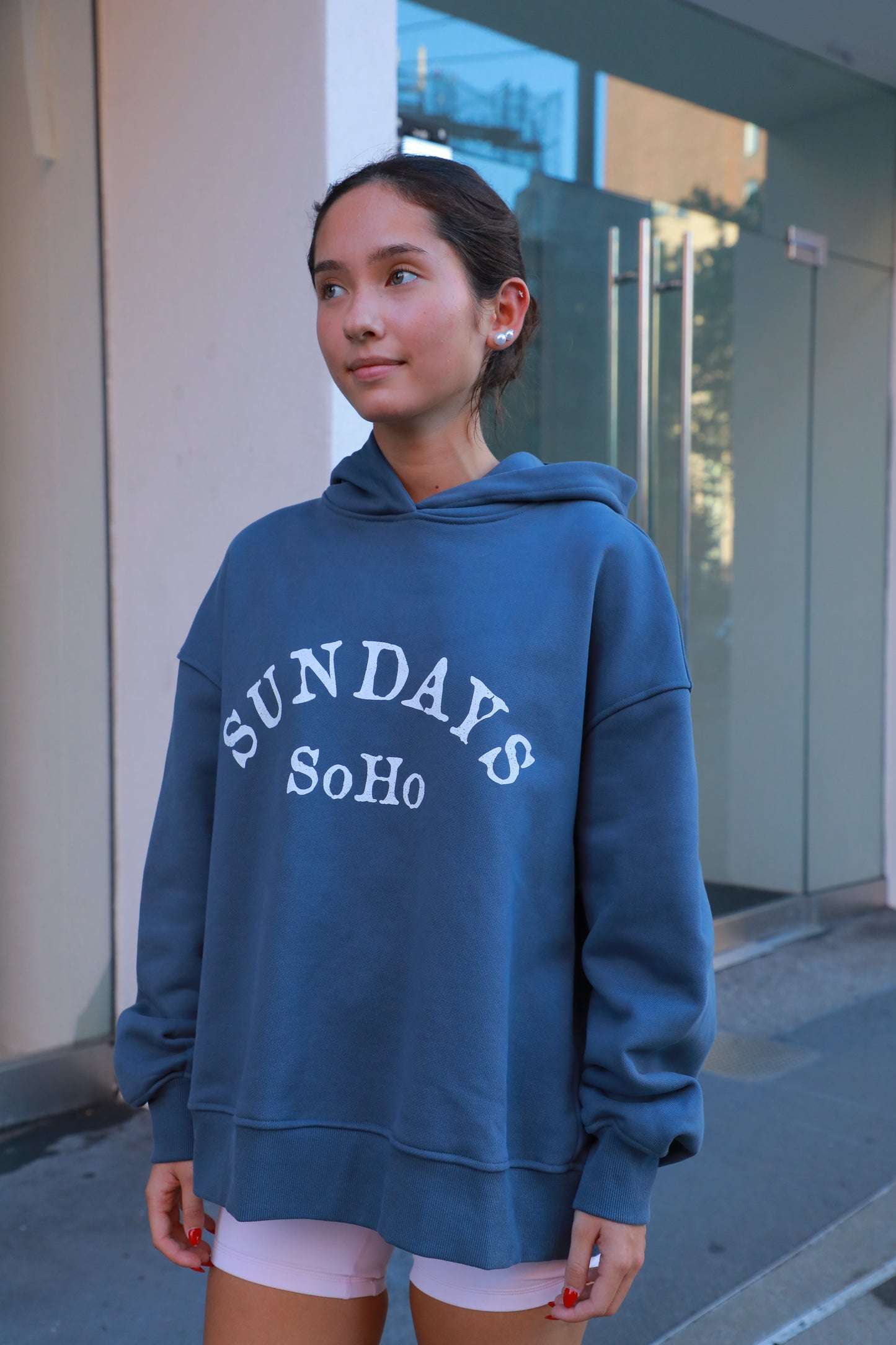 Blue hoodie with front graphic text, pullover hood and long sleeves